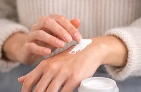 Applying treatment on irritated skin showing skin allergy treatment for allergic reaction rash